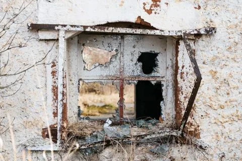 A broken window on an old house Stock Photos