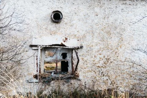 A broken window on an old house Stock Photos
