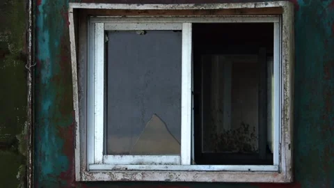 Broken window on old weathered wall of abandoned building Stock Footage 330706151