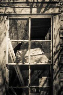 Broken window with shadows Stock Photos