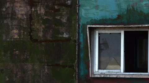 Broken window on weathered abandoned building wall Stock Footage 330706153