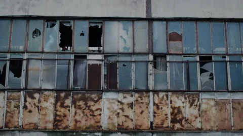 Broken windows on the facade of an old factory. Video stock 149819241