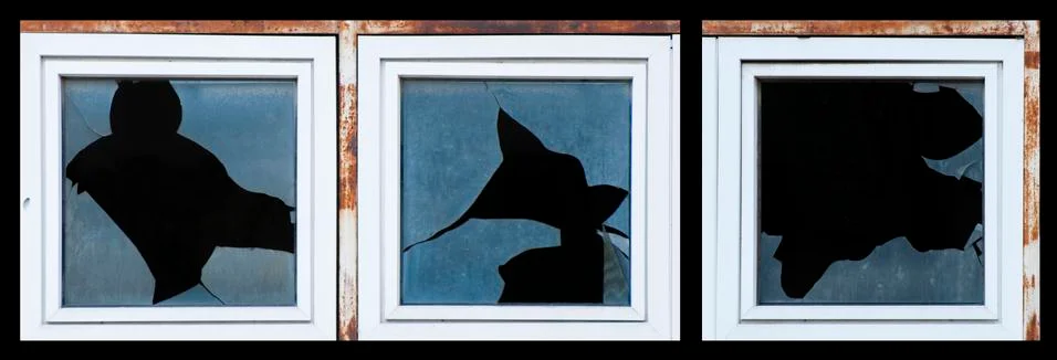 Broken windows of old building Stock Photos