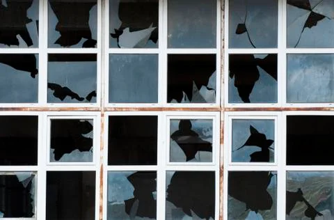 Broken windows of old building Stock Photos