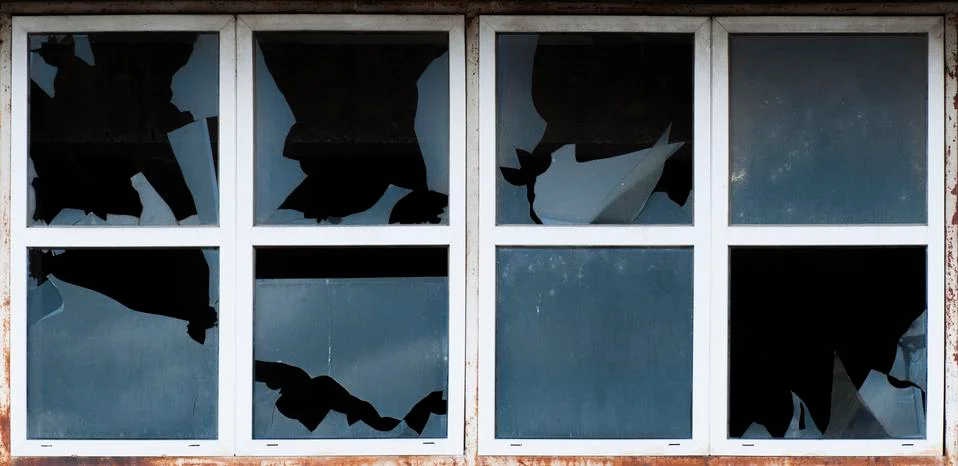 Broken windows of old building Stock Photos