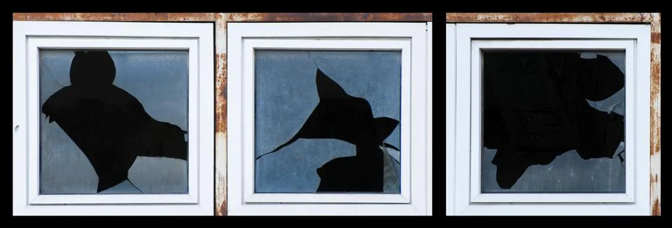 Broken windows of old building Stock Photos