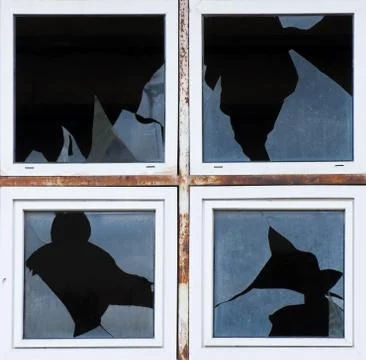 Broken windows of old building Stock Photos