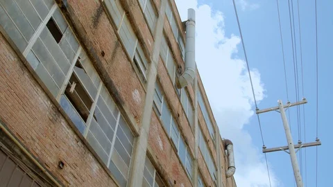 Broken windows, power lines and old brick. 4k60p Stock Footage 130146460