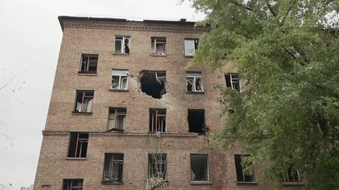 Broken windows in a residential building after Russian shelling of Kyiv Stock Footage 319884459