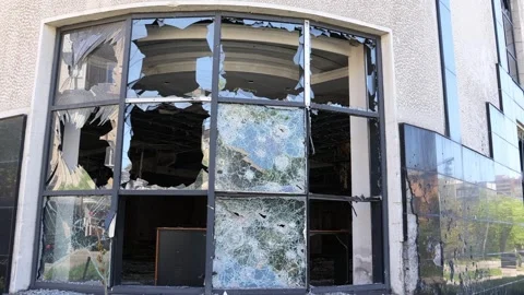 Broken windows from shelling. War. Destroyed property. Stock Footage 241111637