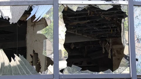 Broken windows from shelling. War. Destroyed property. Stock Footage 241112479
