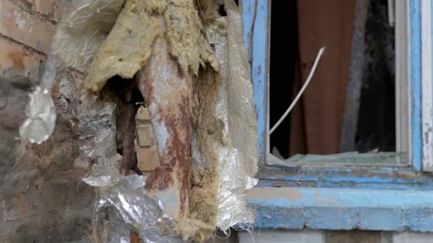 Broken windows with wooden frames due to a russian army shell Stock Footage 196875765