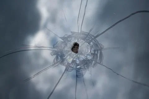 Broken windshield of the car with cracks and chips. Stock Photos