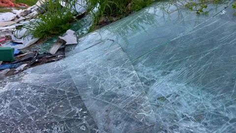 Broken windshield of a car in a garbage dump Stock Footage 240242201