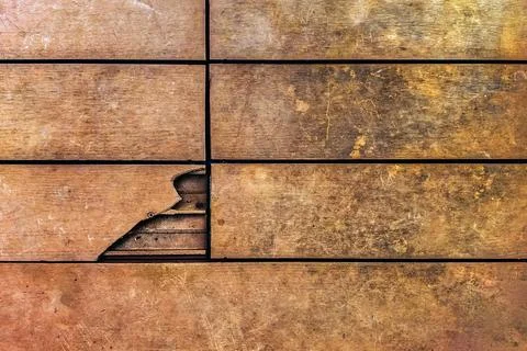Broken WPC composite decking board on outdoor patio. Damaged hollow wood pl.. Stock Photos