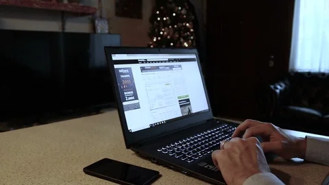 A broker, controls the performance of the financial markets at home Stock Footage 99488655