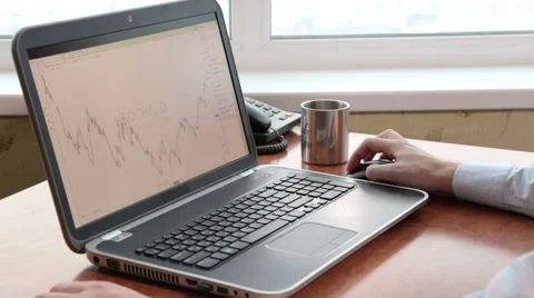 Broker studying currencies with rapid effect Stock Footage 44674118