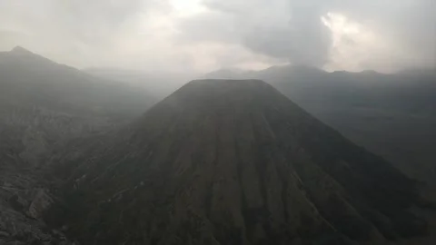 Bromo active volcano East Java Indonesia Hindu pilgrimage site, aerial drone Video stock 312223838