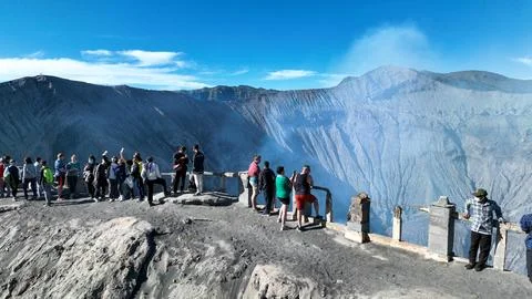 BROMO, JAVA, INDONESIA, JUNE 12, 2023: Tourists line the lookout, taking in Stock Photos