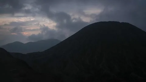 Bromo volcano timelapse Java Indonesia cloudy skyline sunset volcanic landscape Stock Footage 312223365