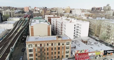 Bronx elevated subway tracks between dense apartment blocks Stock Footage 89246054