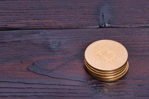 Bronze Bitcoins on a table Stock Photos