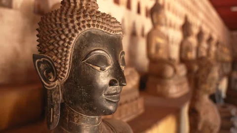 Bronze Buddha statue with serene expression in Wat Sisaket Stock Footage 303684901