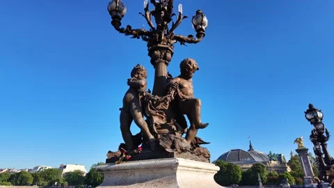 Bronze cherub statues on lamppost of Pont Alexandre III in Paris, France. Close Stock Footage 336900324