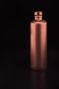 Bronze colored ceramic bottle Stock-Fotos