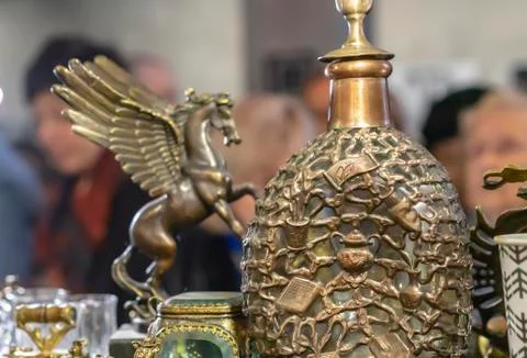 Bronze decanter with a volumetric pattern in a gift shop. Stock Photos