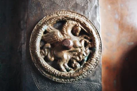 Bronze elements of an old door in the church Stock Photos