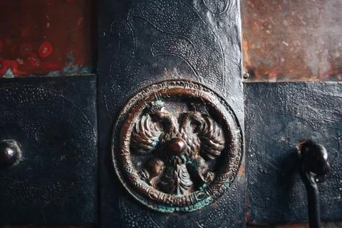 Bronze elements of an old door in the church Stock Photos