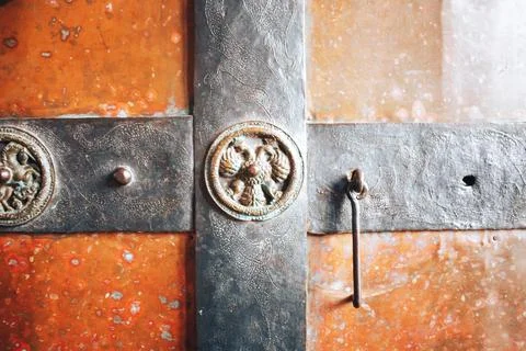 Bronze elements of an old door in the church Foto stock