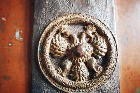 Bronze elements of an old door in the church Stock Photos