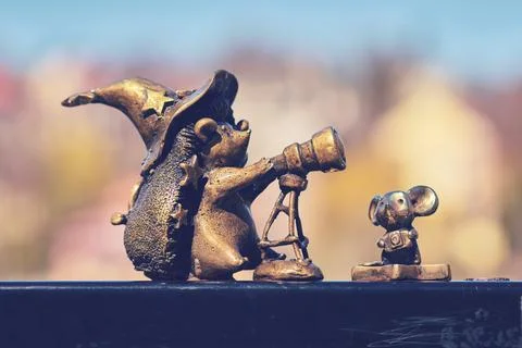 Bronze hedgehog wizard and mouse figurines with telescope artistic statue Stock Photos
