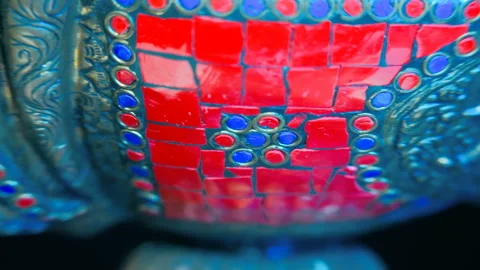 Bronze Indian pitcher richly decorated with ornaments and red and blue tiles   Stock Footage 120732878