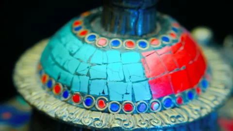 Bronze Indian pitcher richly decorated with ornaments and red and blue tiles   Stock Footage 121590992