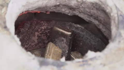 Bronze ingot casting in the crucible Stock Footage 256037799
