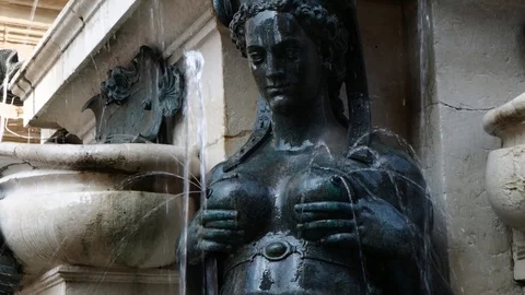 Bronze mermaid squeezing her breast Stock Footage