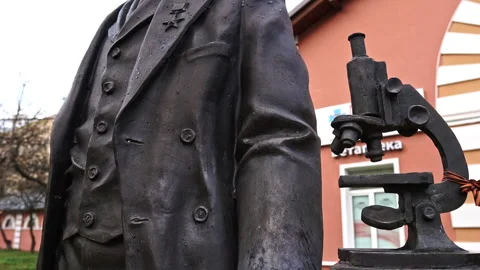 Bronze microscope at the Skryabin monument, veterinary academy, Moscow Stock Footage 277671600