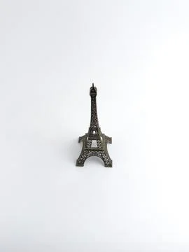 Bronze miniature replica of Eiffel Tower souvenir isolated on a white backg.. Stock Photos