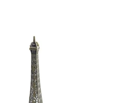 Bronze miniature replica of Eiffel Tower souvenir isolated on a white backg.. Stock Photos