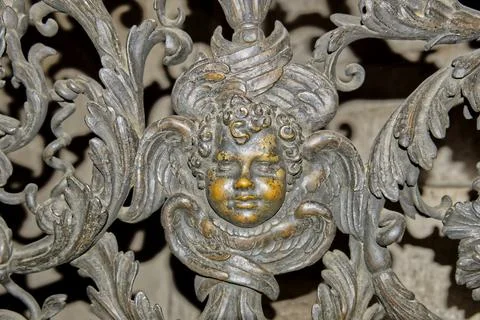 A bronze putto on a railing Stock Photos