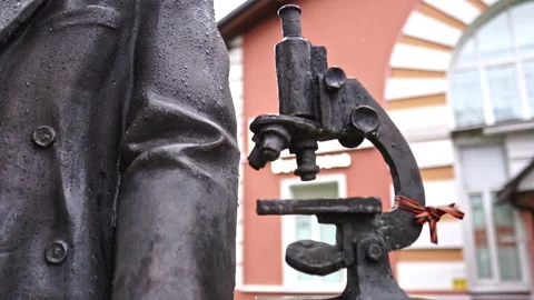 Bronze scientist and microscope on books, veterinary academy, Moscow Stock Footage 277671691