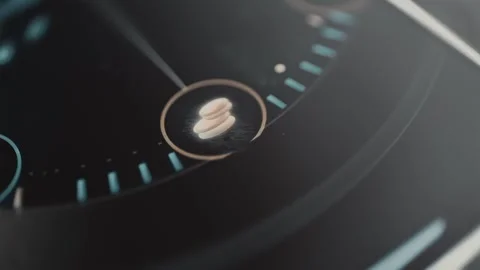 Bronze stack of circular cost tokens stands within a ring of precise radial Stock Footage 343376312
