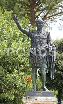 Bronze statue of the emperor Caesar Augustus in the park Stock Photos