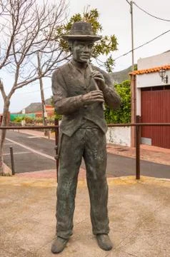 Bronze statue of a flute player Stock Photos