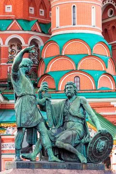 The bronze statue in front of Saint Basil Cathedral at Red Square in Moscow Photos