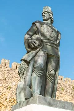 Bronze statue of Gil Eanes standing against a clear blue sky in Lagos. Stock Photos