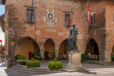 Bronze statue of Julius Caesar, founder of the town in Piazza del Duomo in Stock Photos
